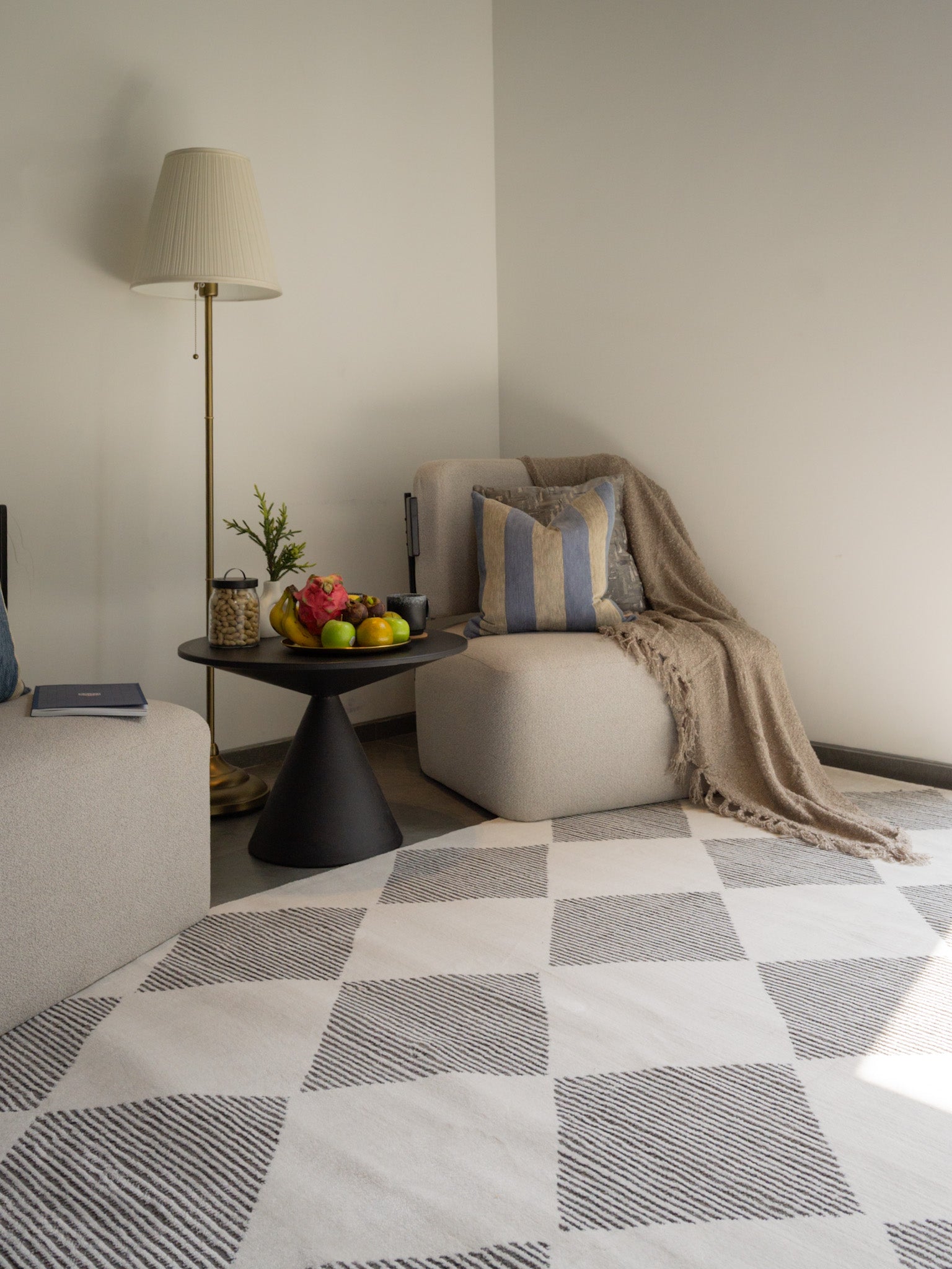 Modern geometric diamond pattern rug in black and white with textured weave