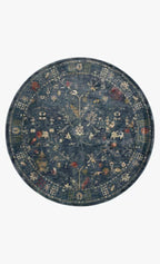 Blue vintage-style rug with floral motifs and ornate border design
