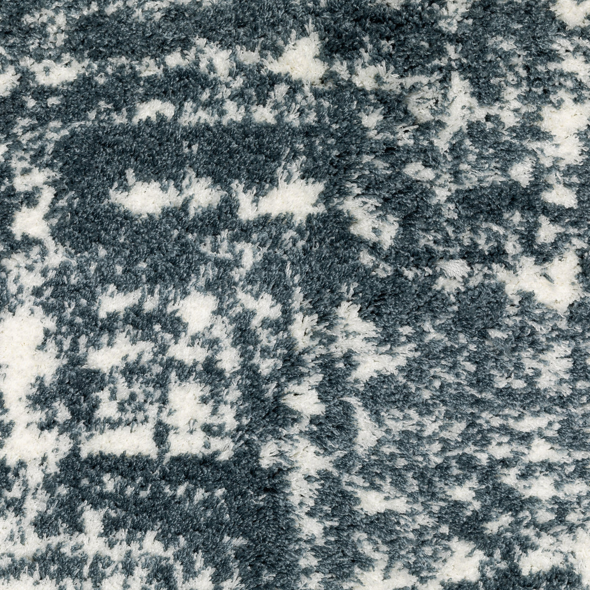 Modern teal and white textured area rug with abstract distressed pattern
