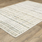 Textured cream and gold flatweave rug with woven geometric pattern design