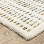Textured cream and gold flatweave rug with woven geometric pattern design