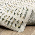 Textured cream and gold flatweave rug with woven geometric pattern design