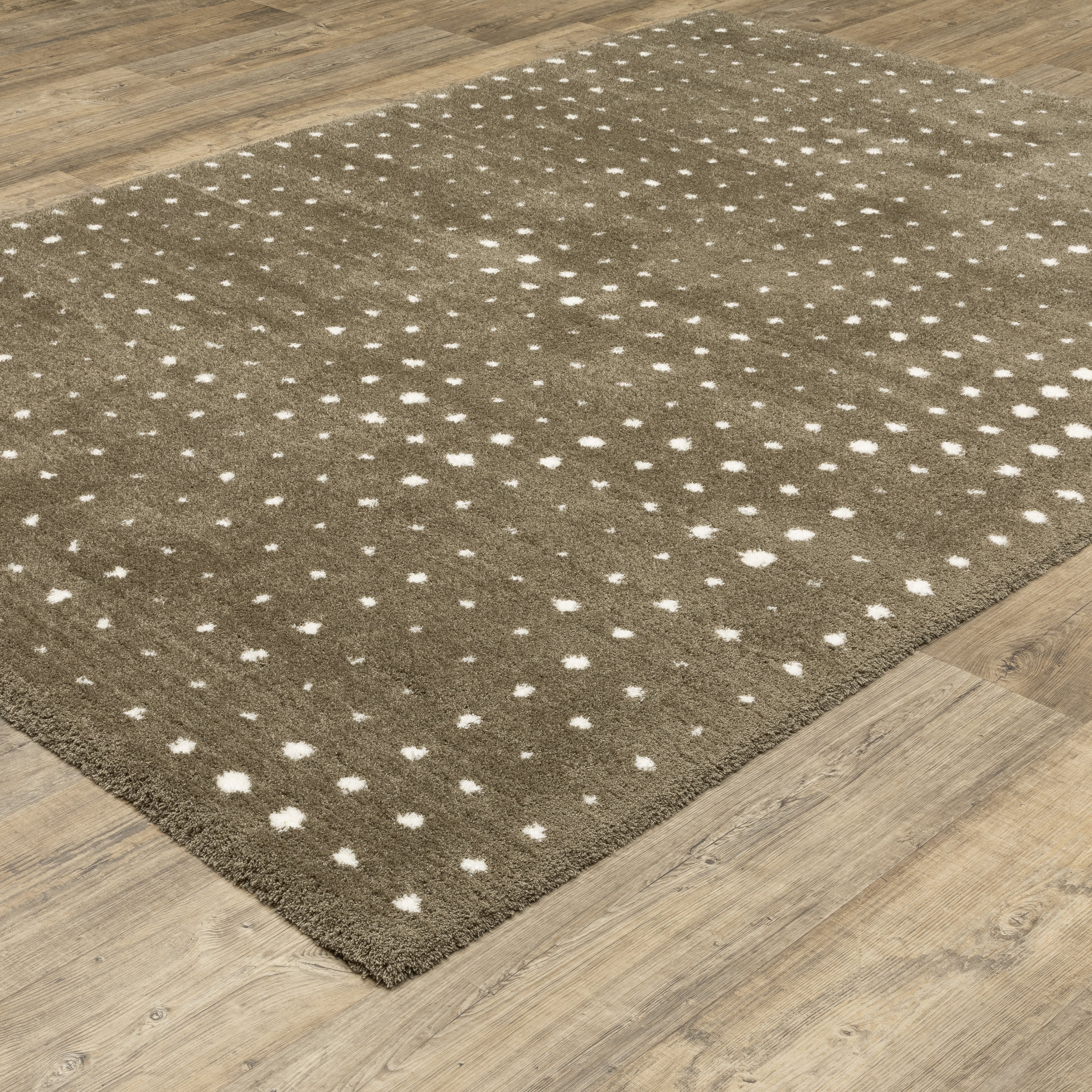 Grey wool rug with white polka dot pattern and textured surface