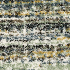 Textured striped area rug in grey, blue, green and cream tones
