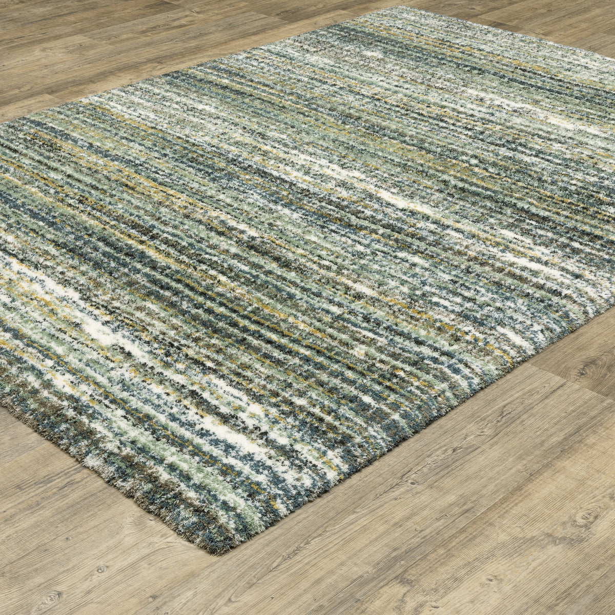Textured striped area rug in grey, blue, green and cream tones