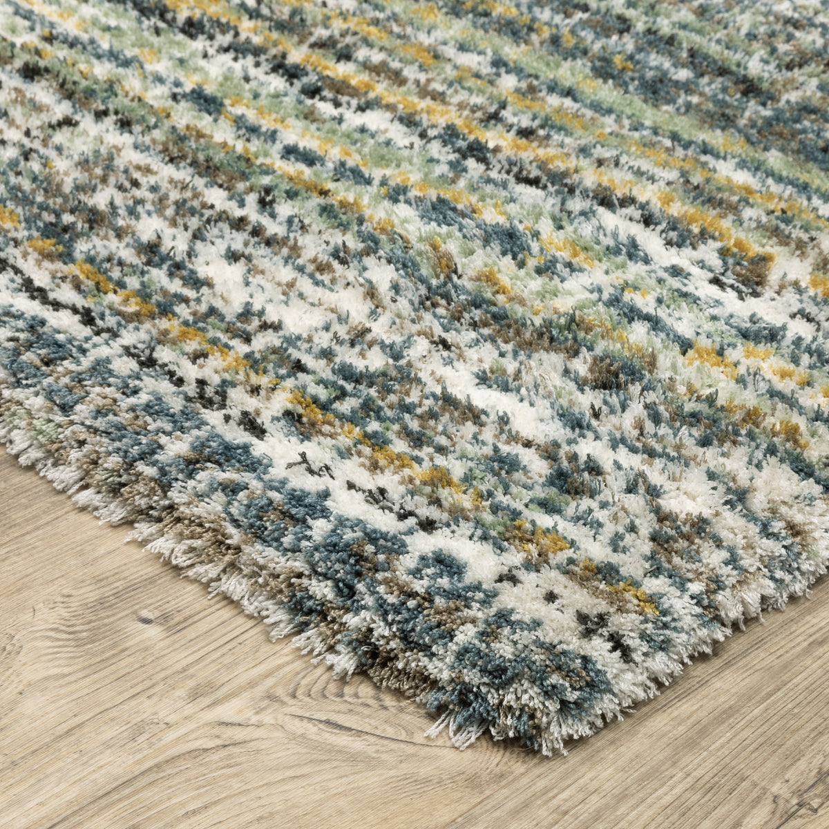 Textured striped area rug in grey, blue, green and cream tones