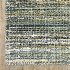 Textured striped area rug in grey, blue, green and cream tones