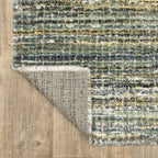 Textured striped area rug in grey, blue, green and cream tones