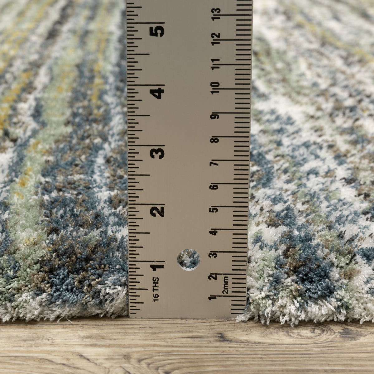 Textured striped area rug in grey, blue, green and cream tones