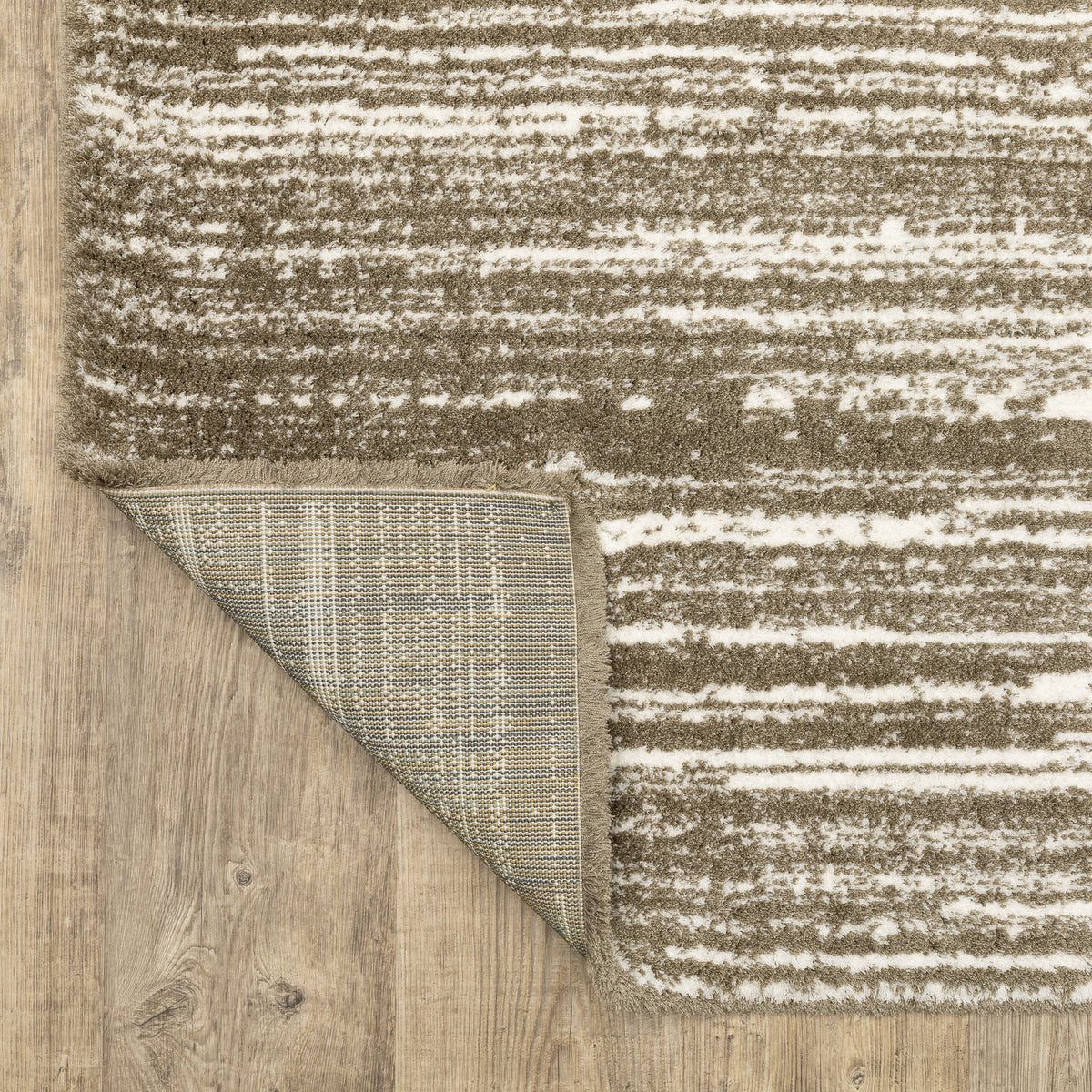 Brown and cream striped texture rug with horizontal woven pattern