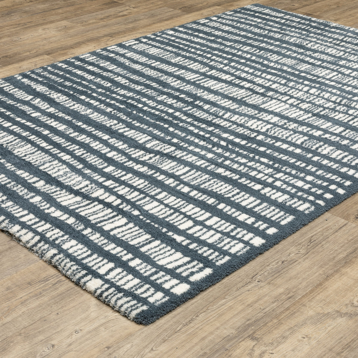Teal and white striped wool rug with textured horizontal pattern detail