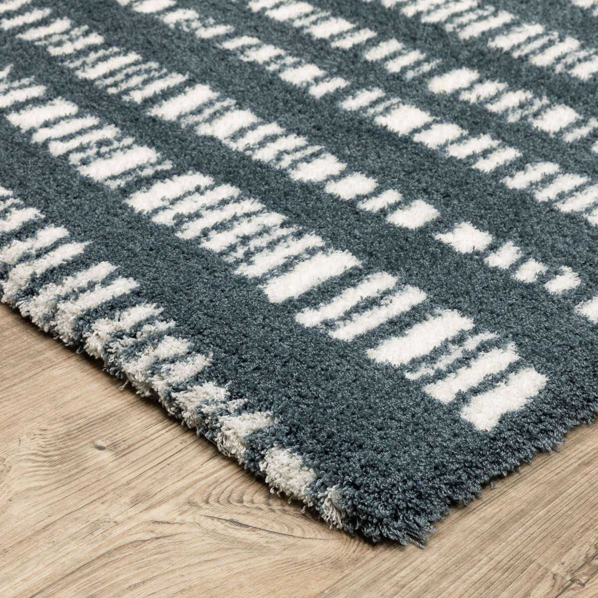 Teal and white striped wool rug with textured horizontal pattern detail