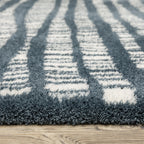 Teal and white striped wool rug with textured horizontal pattern detail
