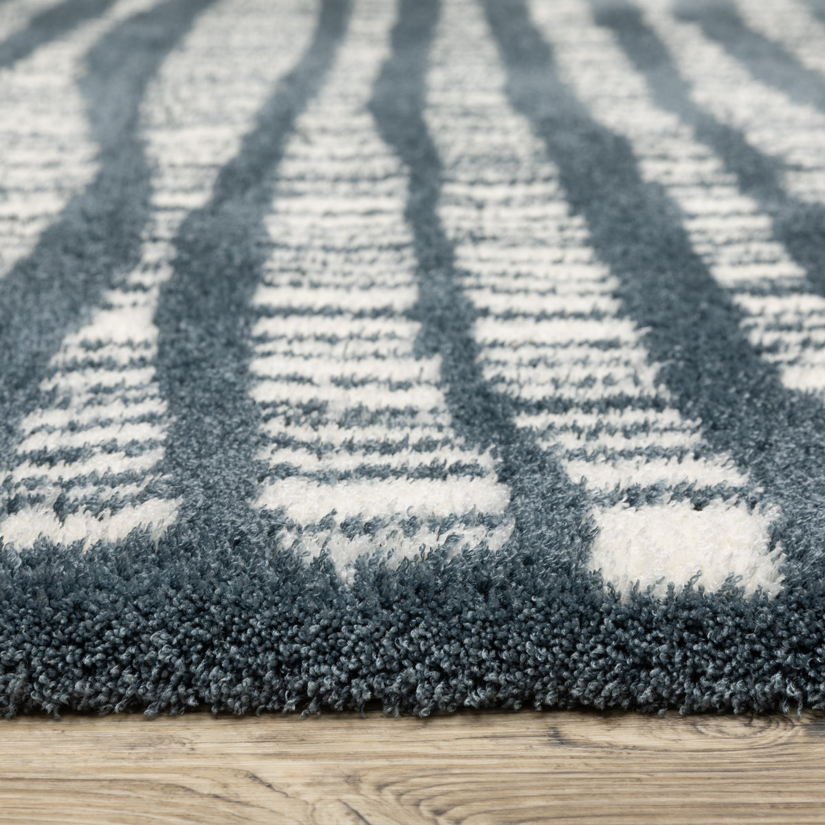 Teal and white striped wool rug with textured horizontal pattern detail