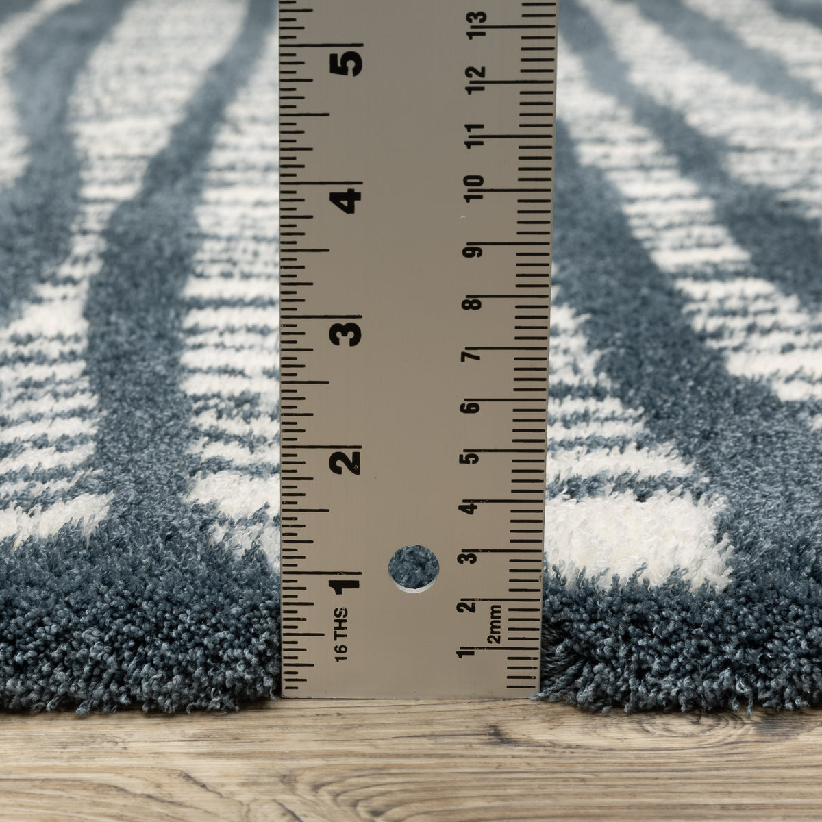 Teal and white striped wool rug with textured horizontal pattern detail