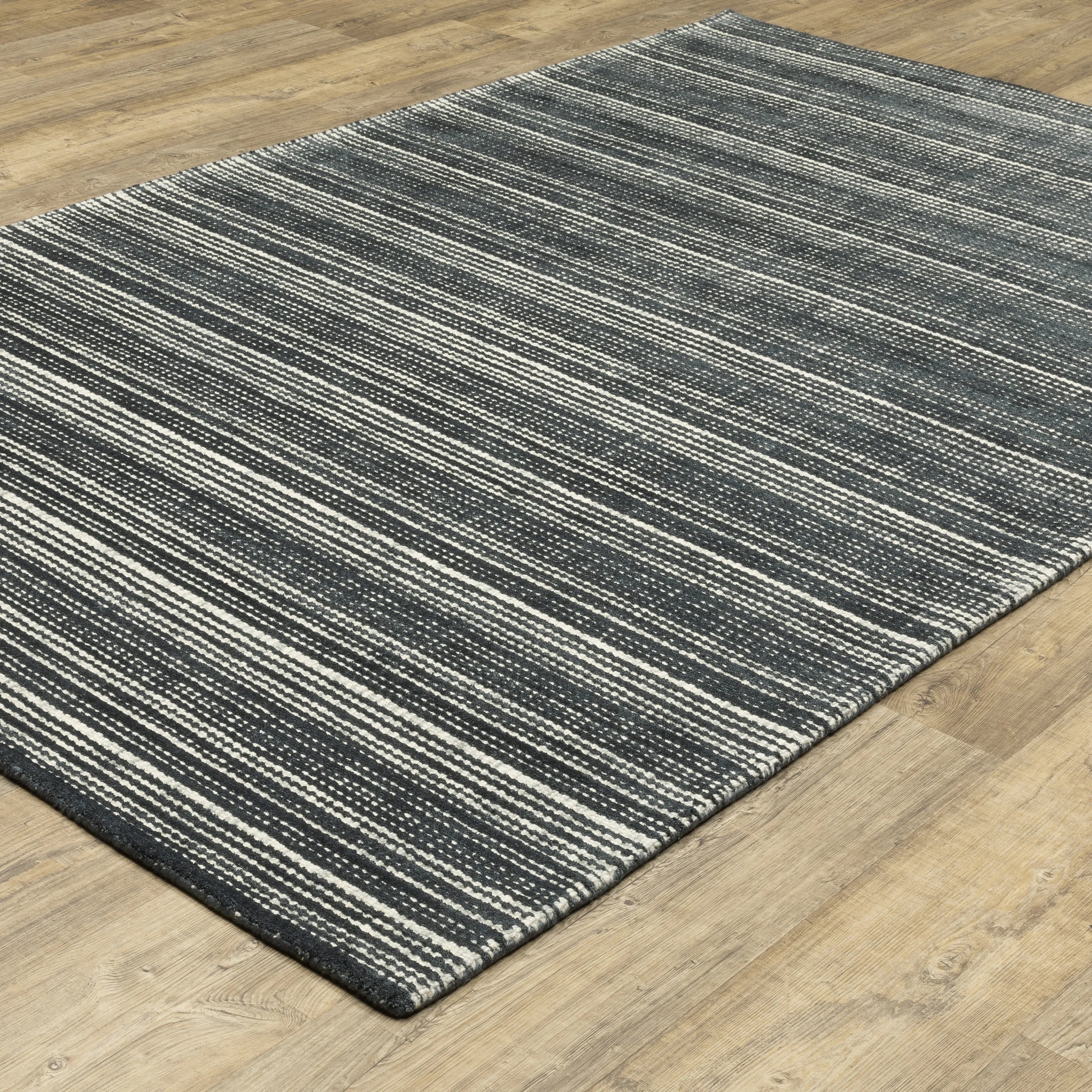 Charcoal grey striped wool rug with horizontal woven texture pattern
