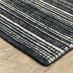 Charcoal grey striped wool rug with horizontal woven texture pattern