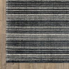 Charcoal grey striped wool rug with horizontal woven texture pattern
