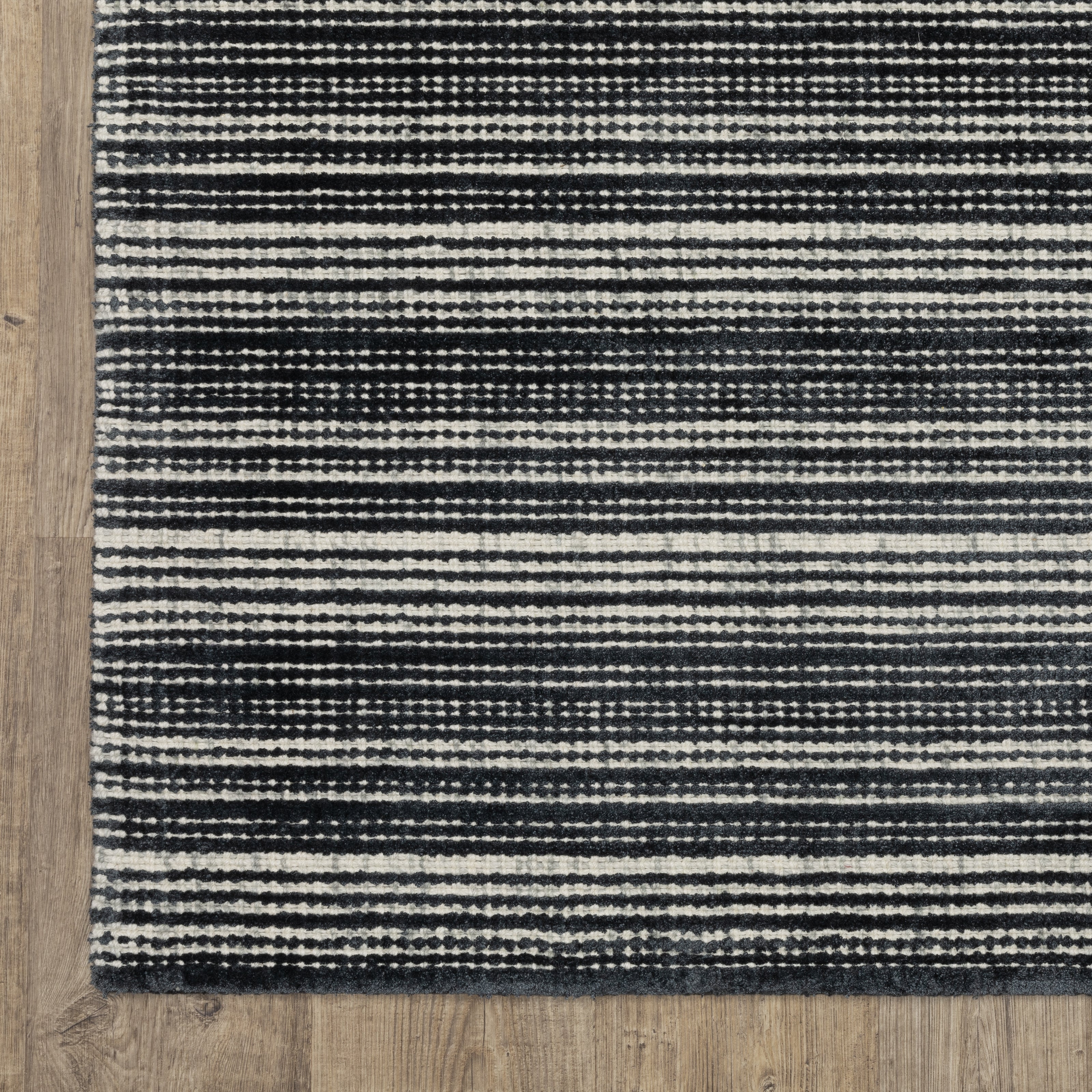 Charcoal grey striped wool rug with horizontal woven texture pattern
