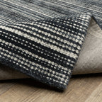 Charcoal grey striped wool rug with horizontal woven texture pattern
