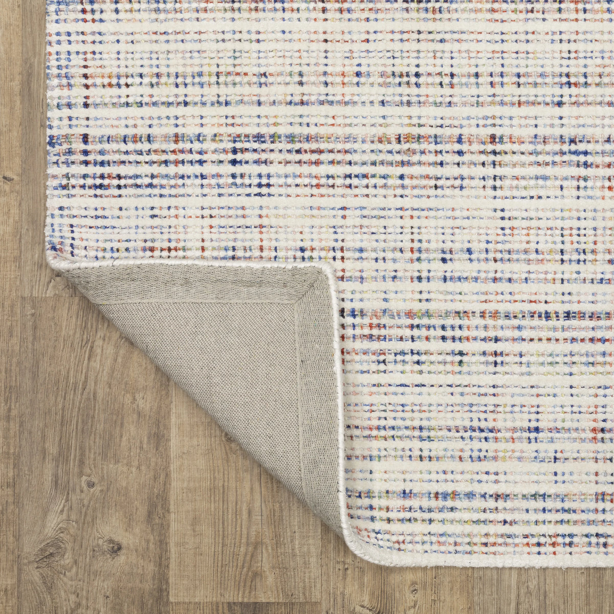 Modern cream and blue striped wool rug on light wood flooring