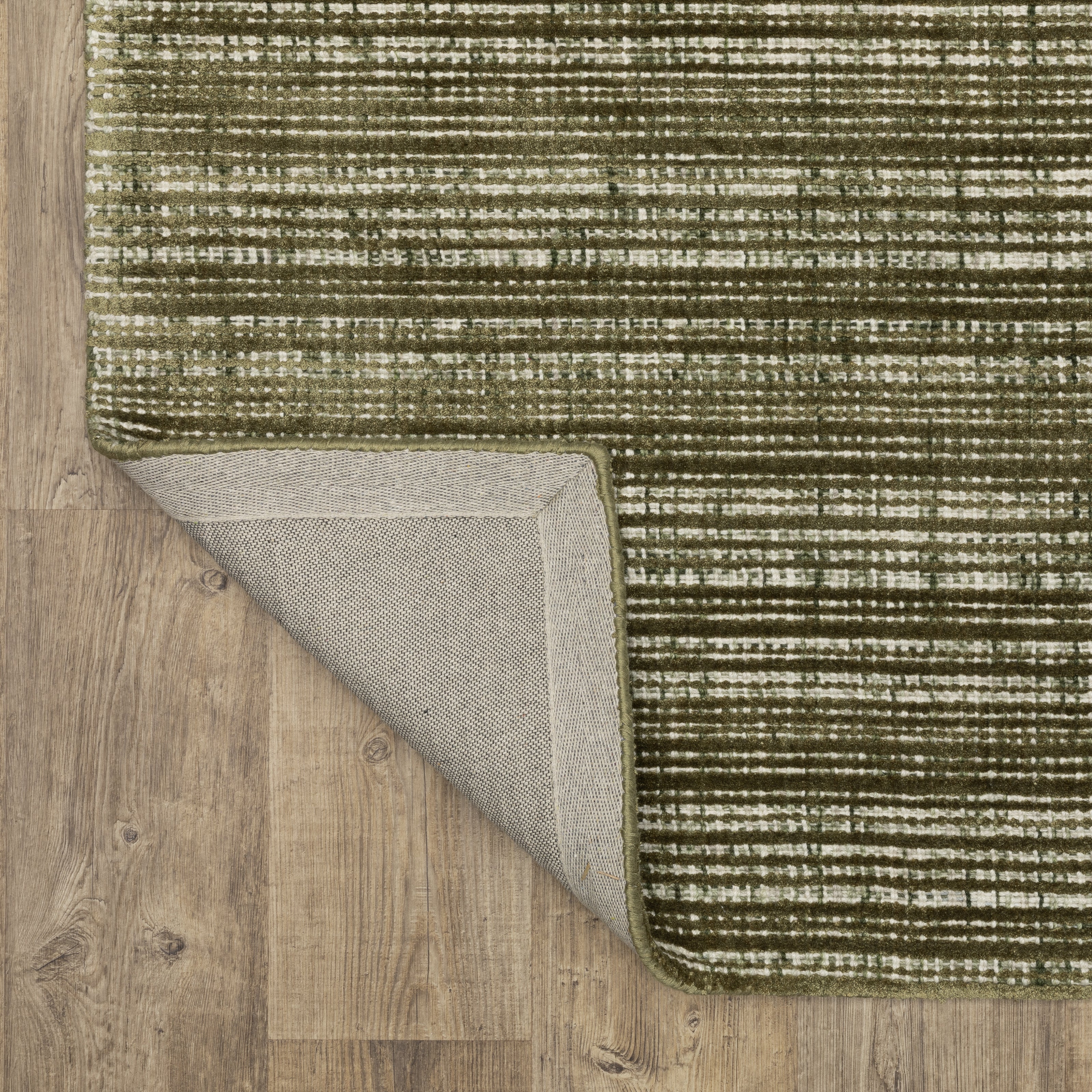 Sage green textured rug with horizontal woven pattern and natural fiber appearance