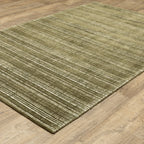 Sage green textured rug with horizontal woven pattern and natural fiber appearance