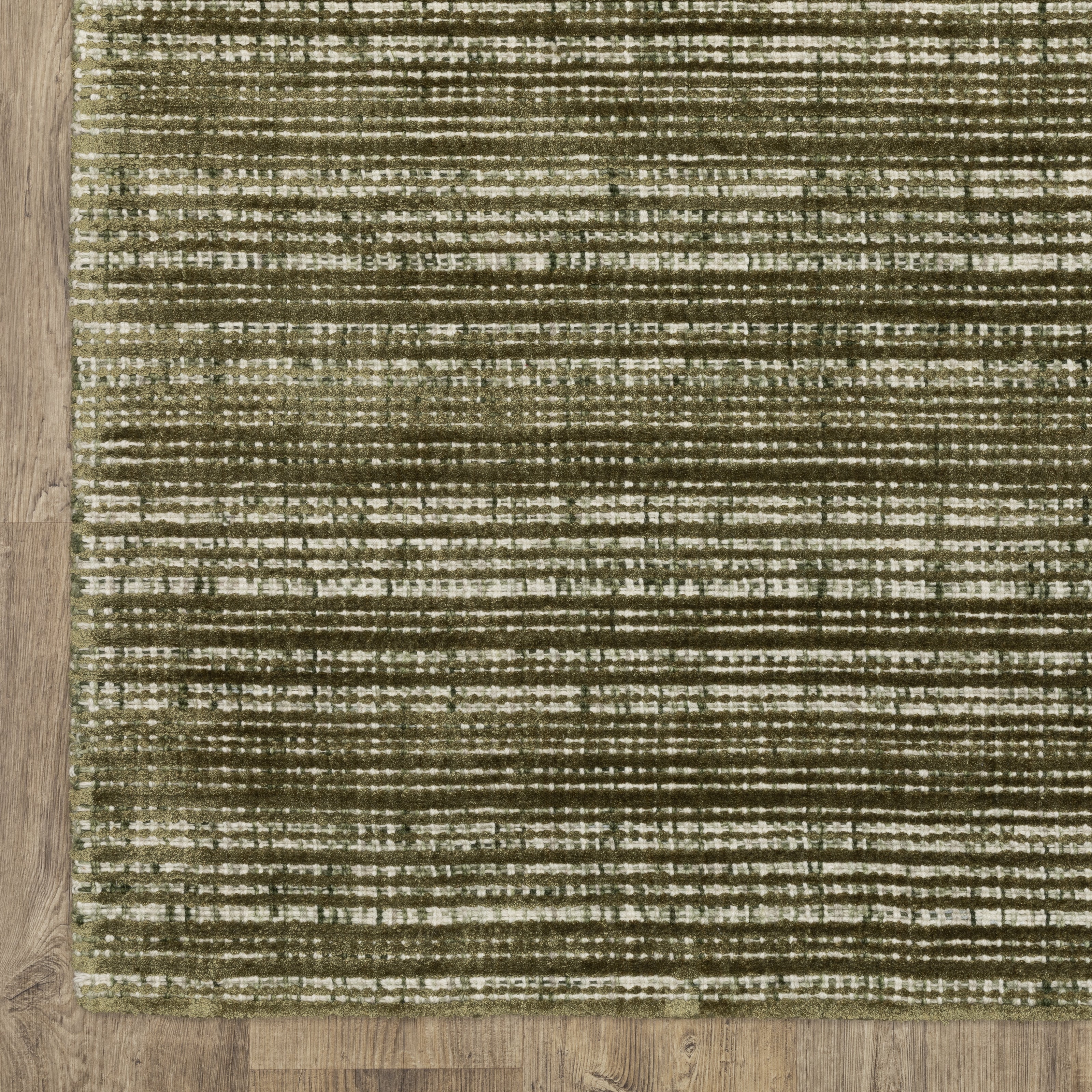 Sage green textured rug with horizontal woven pattern and natural fiber appearance