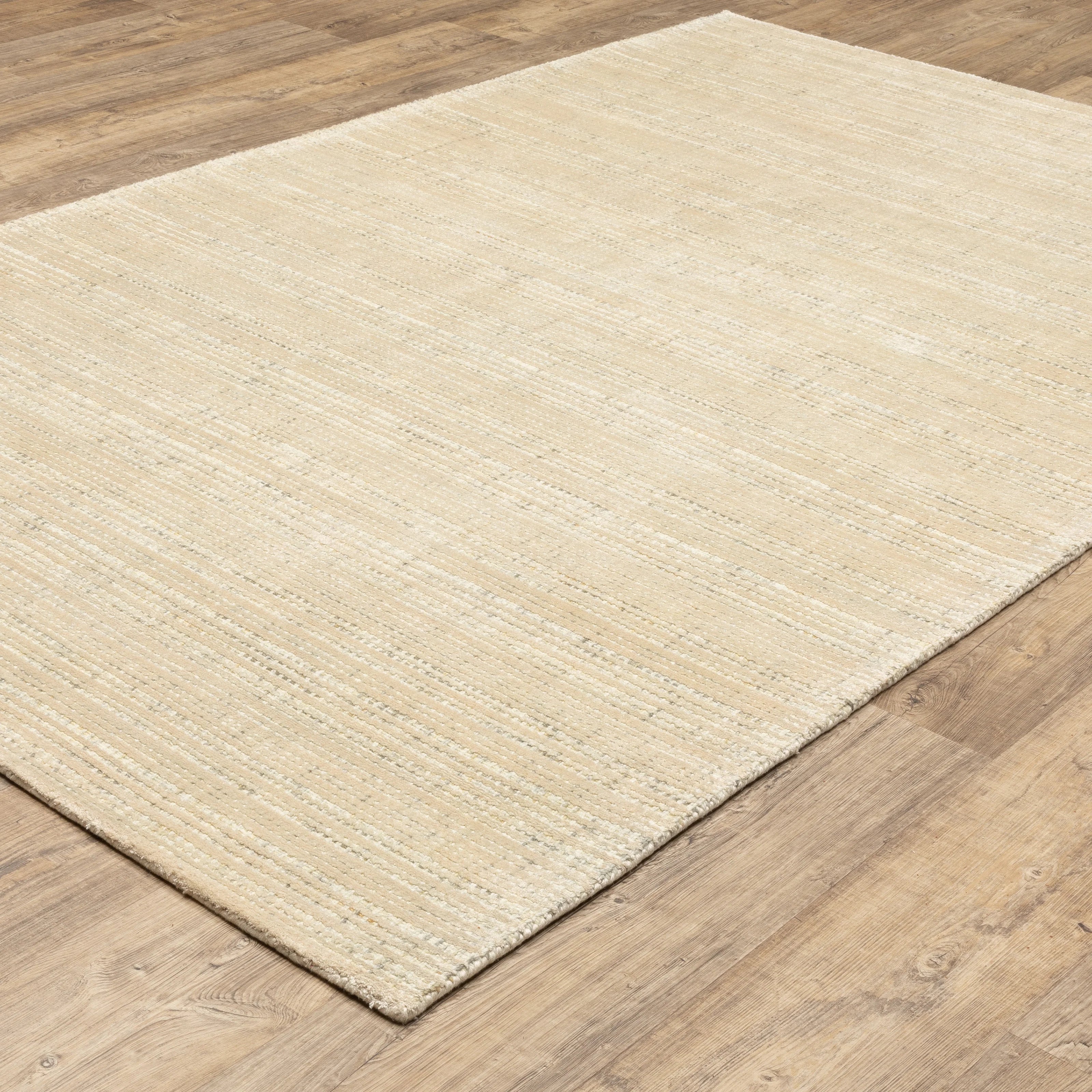 Handwoven cream and beige textured area rug with natural fiber appearance