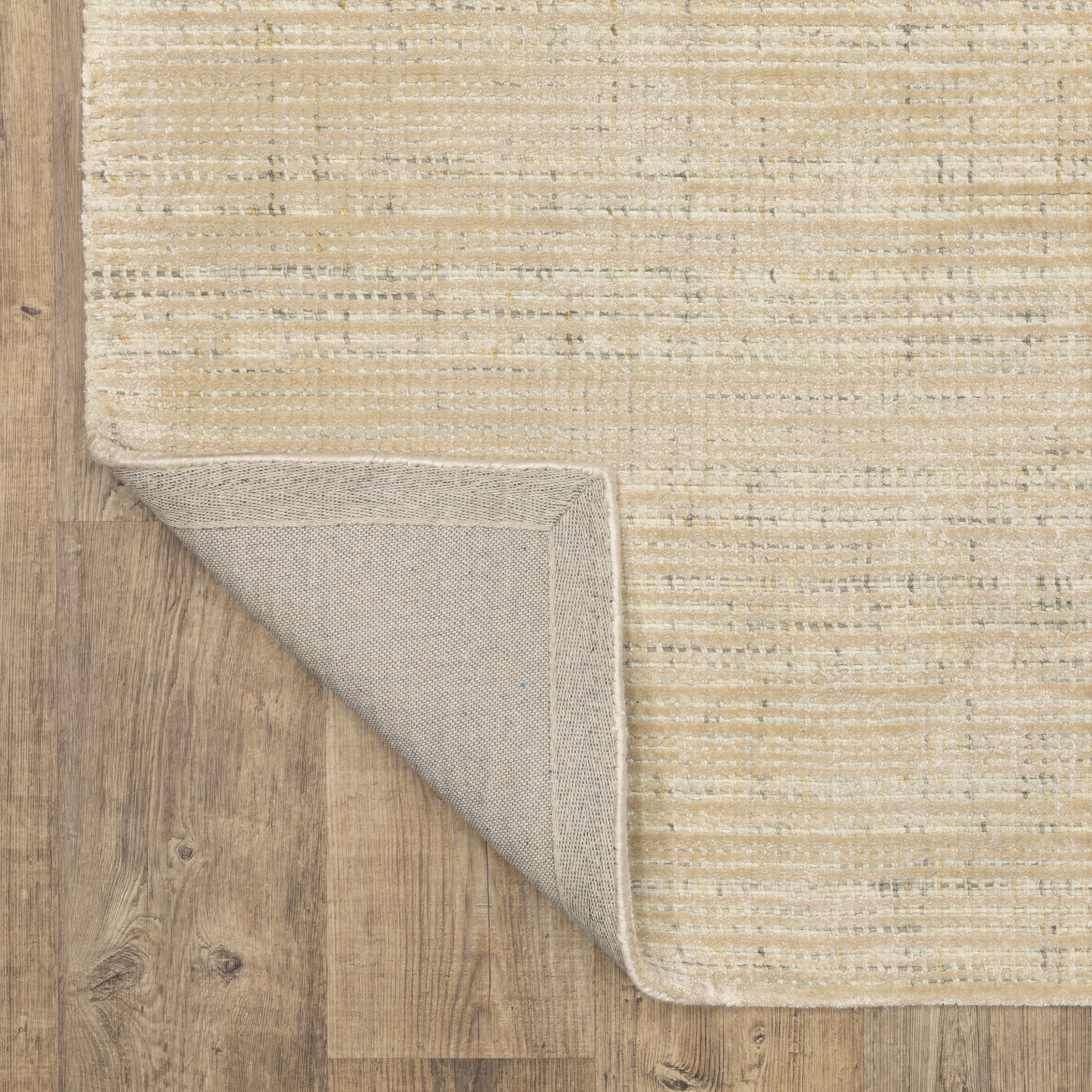 Handwoven cream and beige textured area rug with natural fiber appearance
