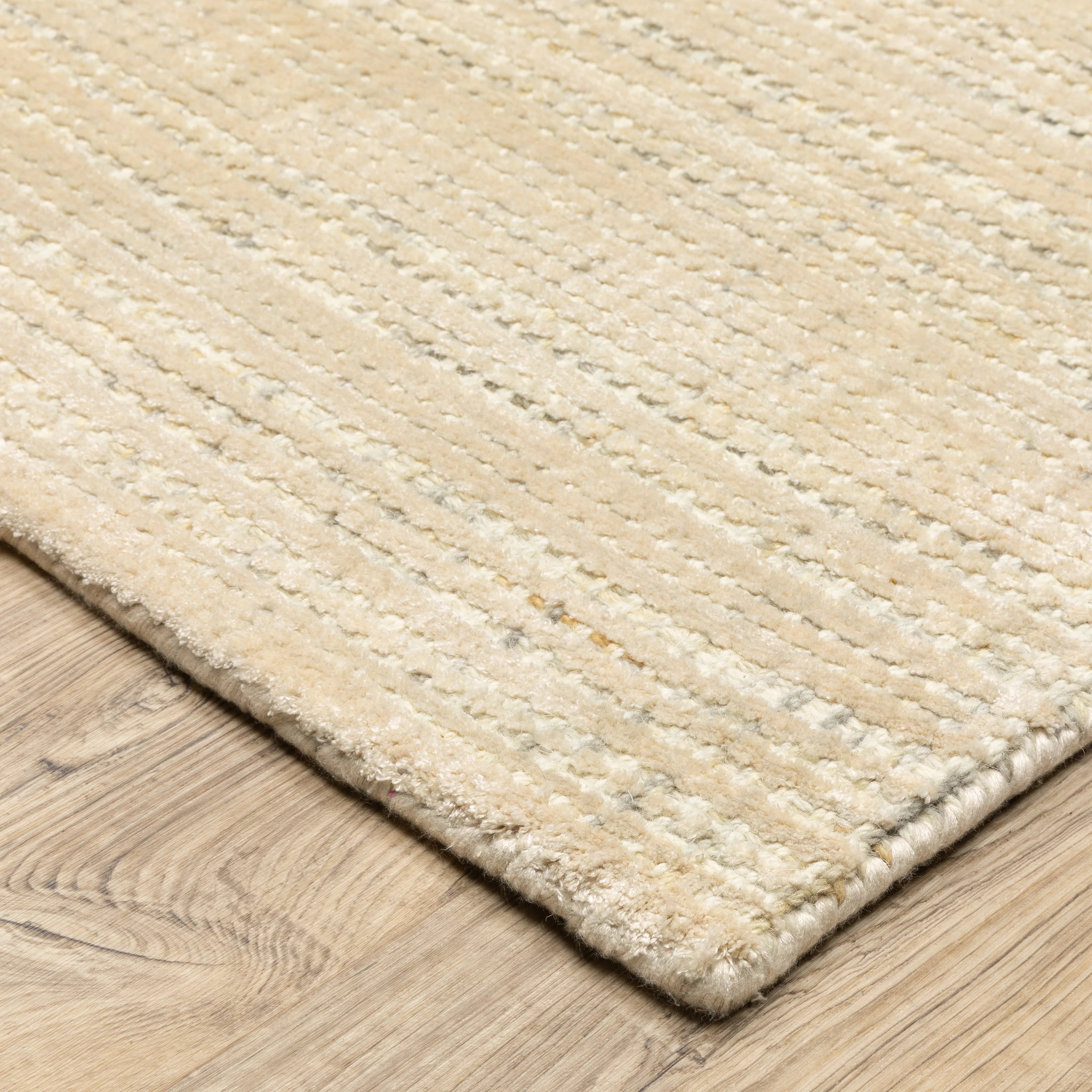 Handwoven cream and beige textured area rug with natural fiber appearance
