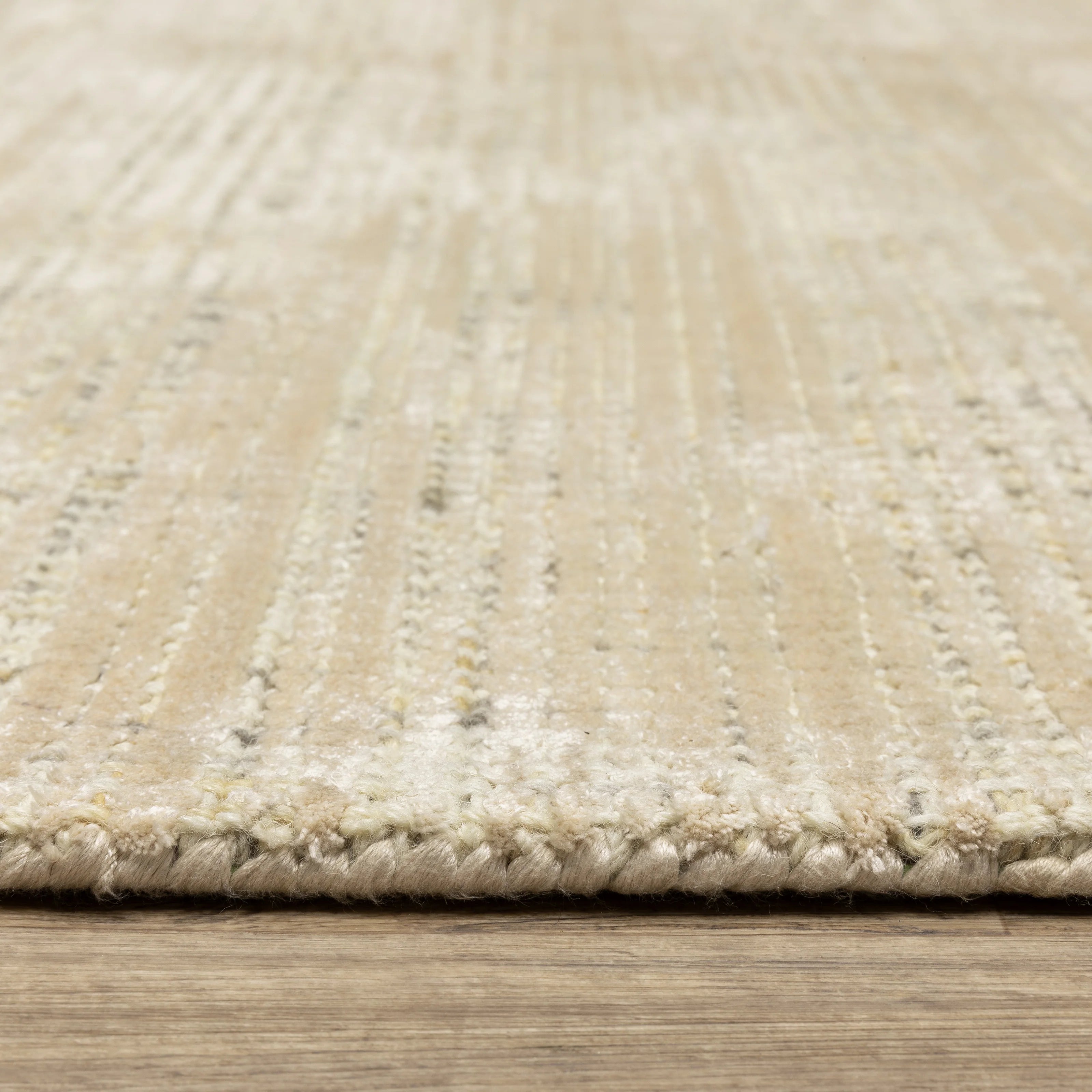 Handwoven cream and beige textured area rug with natural fiber appearance