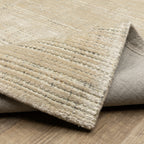 Handwoven cream and beige textured area rug with natural fiber appearance
