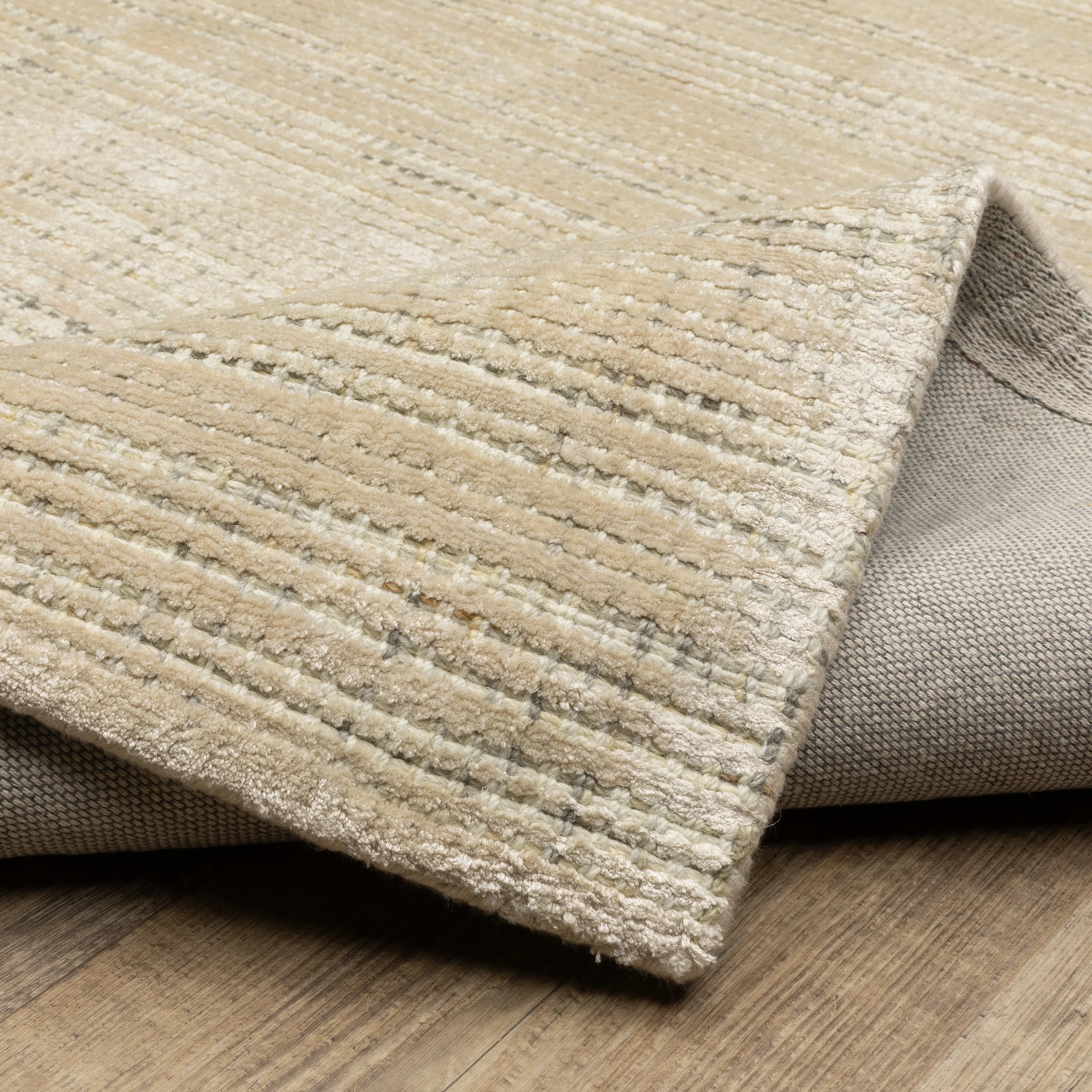 Handwoven cream and beige textured area rug with natural fiber appearance