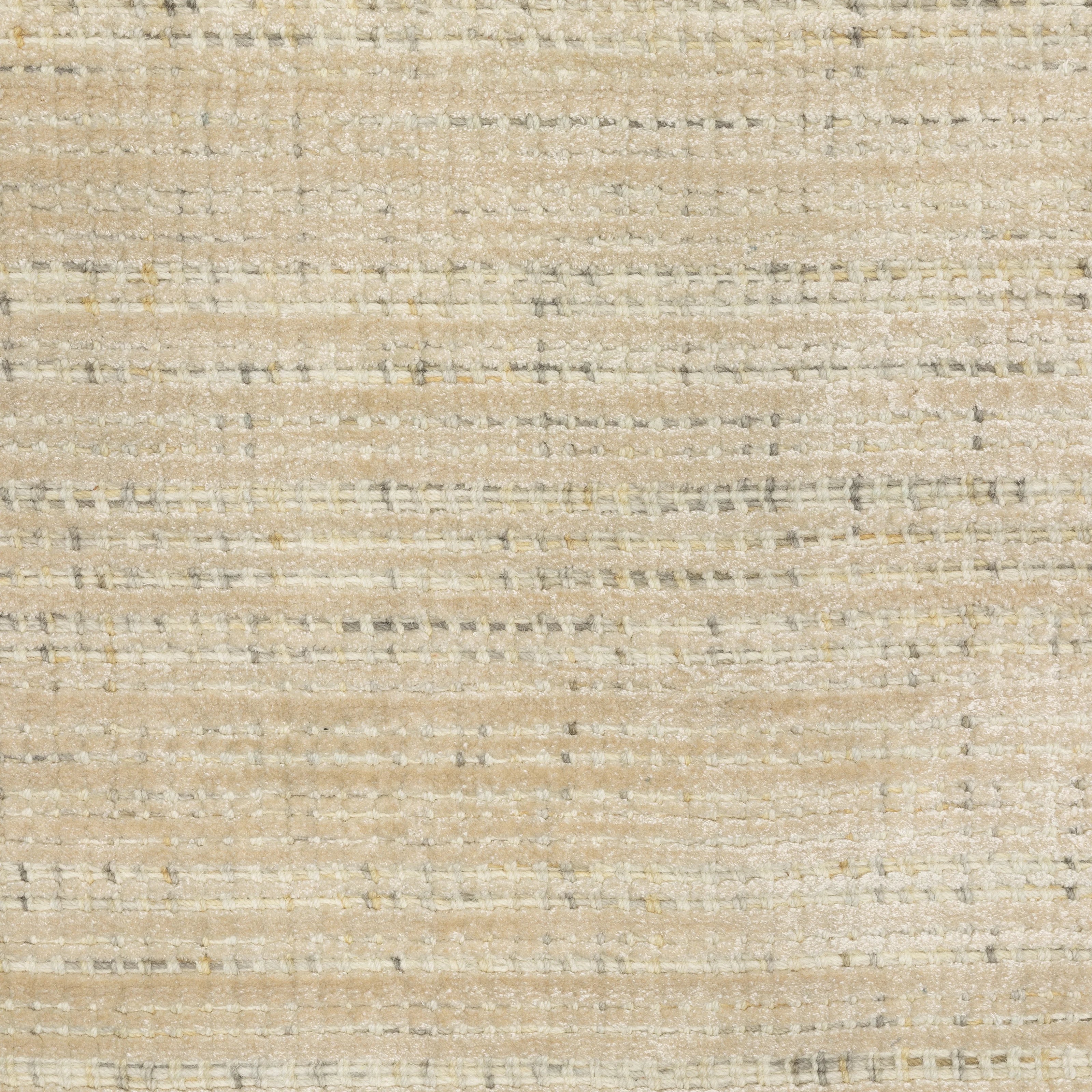 Handwoven cream and beige textured area rug with natural fiber appearance