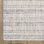 Modern cream and blue striped wool rug on light wood flooring