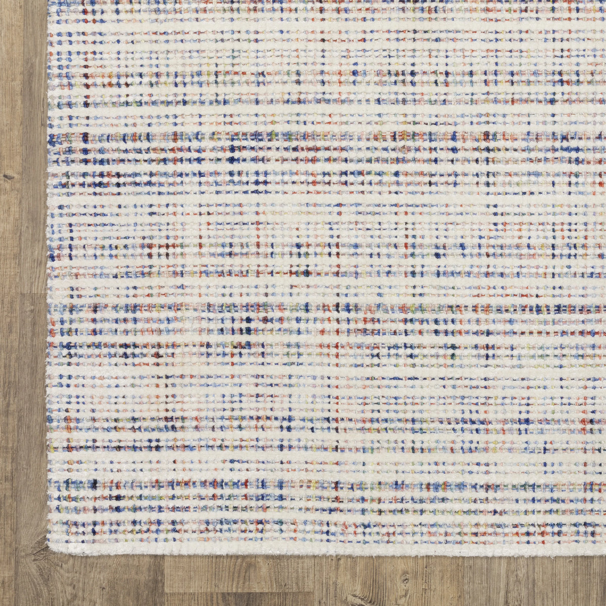 Modern cream and blue striped wool rug on light wood flooring