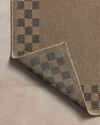 Beige and gray checkered border area rug with natural woven texture