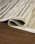 Cream textured rug with geometric brick pattern and subtle tonal details