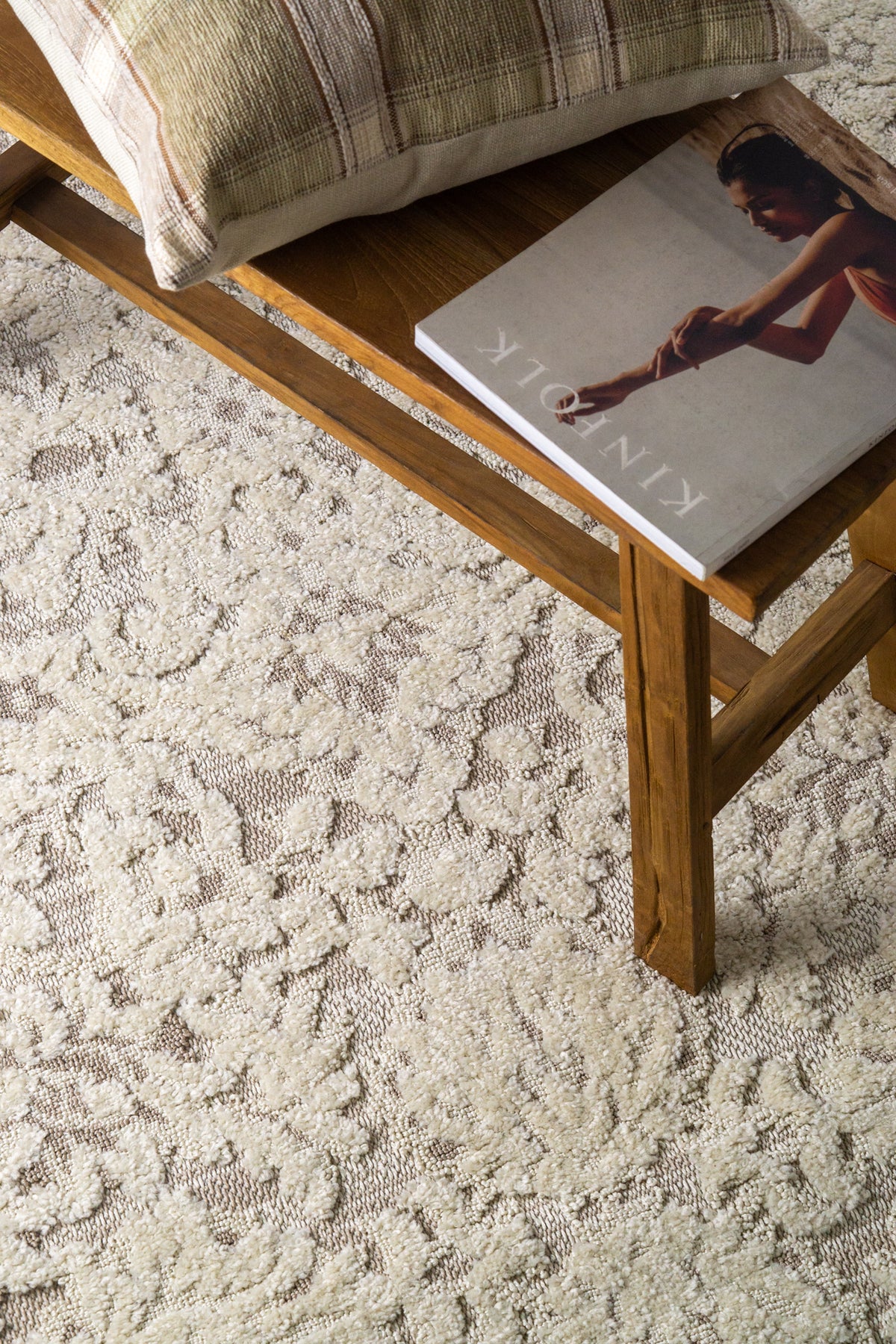 Cream and taupe traditional floral patterned area rug with ornate border