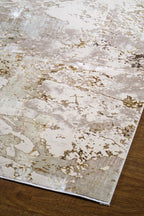 Distressed beige and gold textured area rug with vintage worn finish