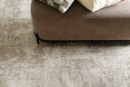 Distressed beige and taupe abstract rug with weathered texture design