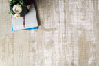 Cream and gold geometric Greek key patterned rug with textured distressed finish