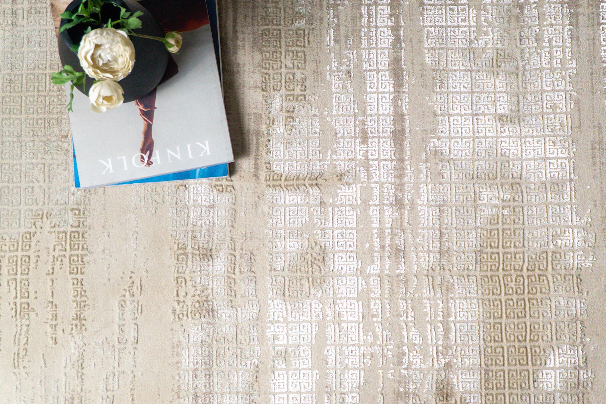 Cream and gold geometric Greek key patterned rug with textured distressed finish