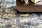 Gray and beige abstract distressed rug with modern textured pattern design