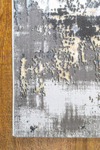 Gray and beige abstract distressed rug with modern textured pattern design