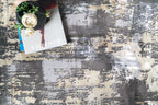 Gray and beige abstract distressed rug with modern textured pattern design