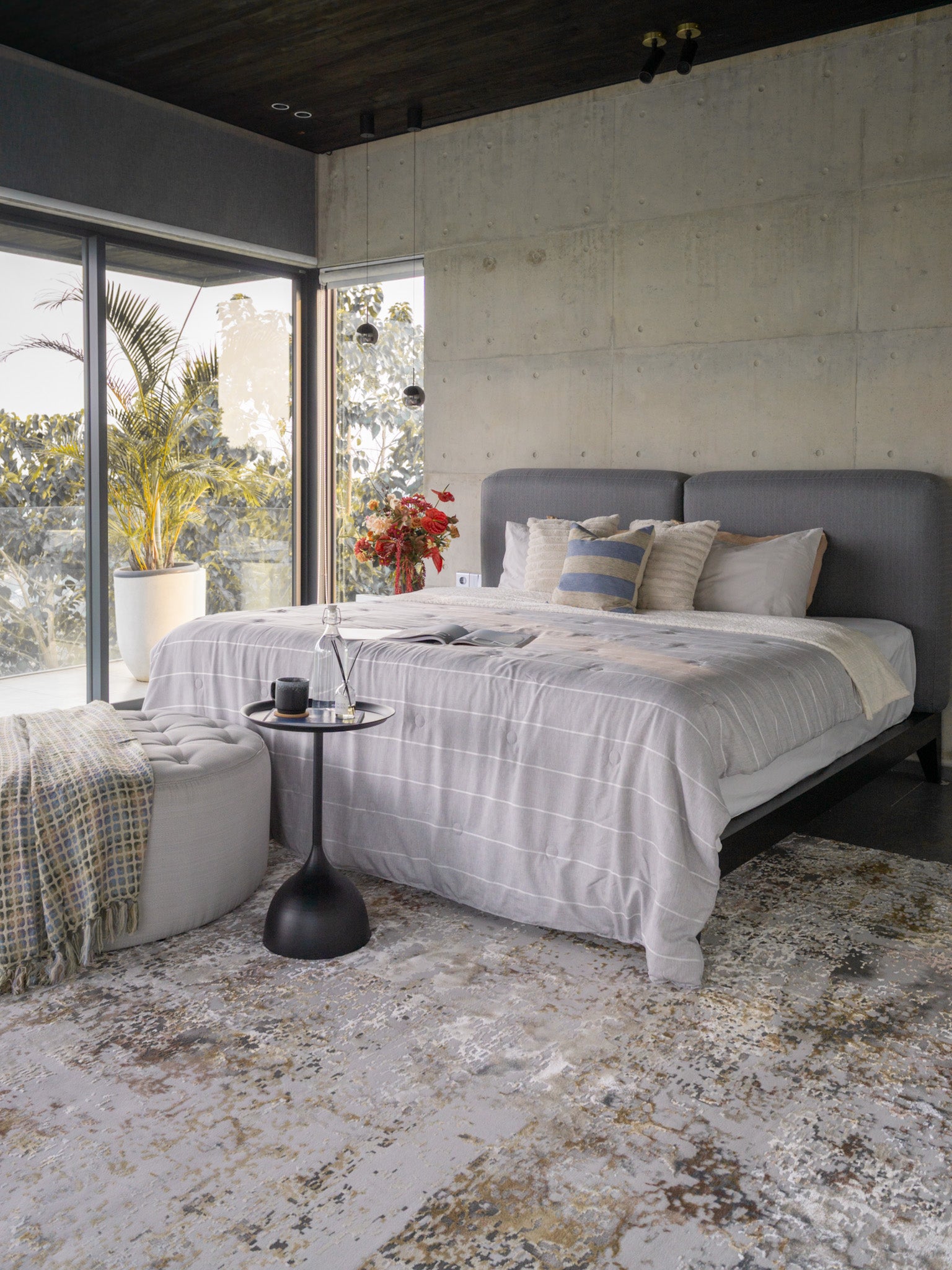 Abstract distressed rug with gold, grey, and cream weathered texture pattern