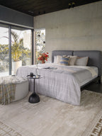 Cream and gold geometric Greek key patterned rug with textured distressed finish
