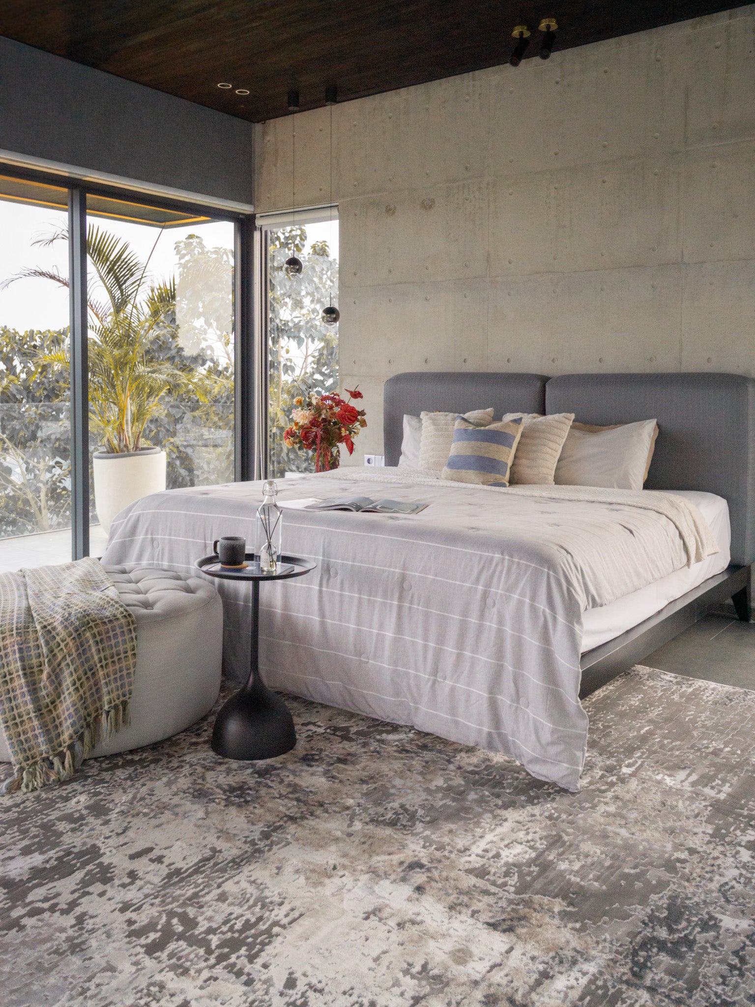Modern distressed area rug in grey and cream tones with abstract pattern